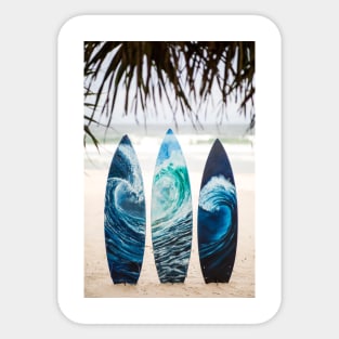 Surf boards with painted ocean waves on the beach with trees Sticker